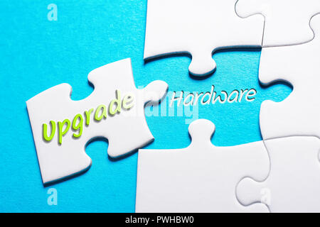 The Words Upgrade And Hardware In Missing Piece Jigsaw Puzzle Stock Photo