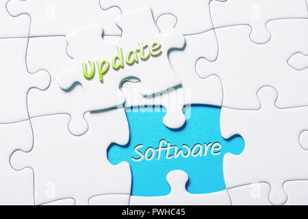 The Words Update And Software In Missing Piece Jigsaw Puzzle Stock Photo