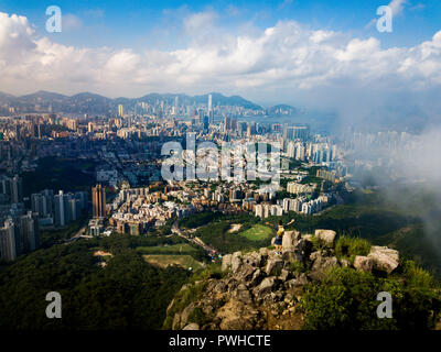 Man enjoying Hong Kong city view from the Lion rock aerial view Stock Photo