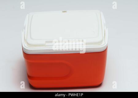 Close up of handheld red refrigerator on white background. Stock Photo