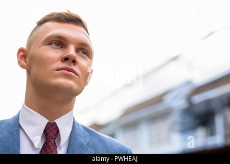 Portrait of young businessman in the streets outdoors Stock Photo