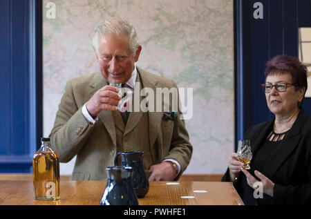 The Prince of Wales, known as the Duke of Rothesay while in Scotland, takes part in a whisky tasting with master blender Maureen Robinson during a visit to the Royal Lochnagar Distillery at Crathie on Royal Deeside. Stock Photo