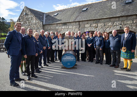 The Prince of Wales, known as the Duke of Rothesay while in Scotland, poses for a group photograph with the distillery staff during a visit to the Royal Lochnagar Distillery at Crathie on Royal Deeside. Stock Photo