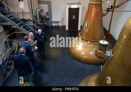 The Prince of Wales, known as the Duke of Rothesay while in Scotland, tours the whisky still house during a visit to the Royal Lochnagar Distillery at Crathie on Royal Deeside. Stock Photo