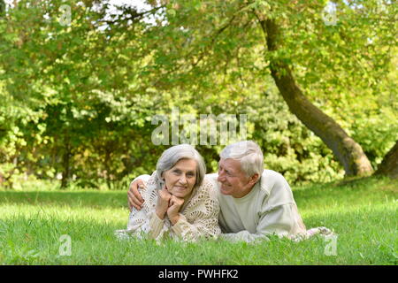 Portrait of elderly couple in autumn park Stock Photo