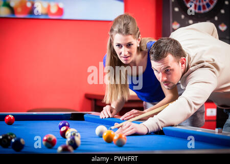 Couple playing pool Stock Photo