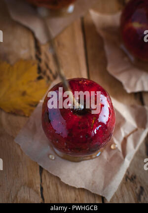 Candy apple on wooden background, top view Stock Photo