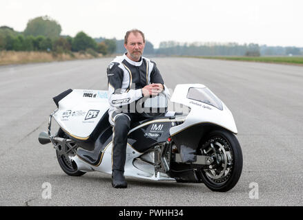 Graham Sykes on his 'Force of Nature' steam rocket bike ahead of tow testing his bike in preparation for his world land speed record attempt for a steam powered vehicle, during the Straightliners top speed &amp; wheelie event at Elvington Airfield in Yorkshire. Stock Photo