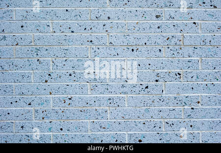 Grey flecked brick wall Stock Photo