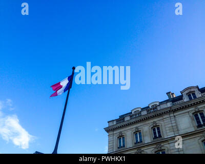 French Flag blowing high up in the sky Stock Photo
