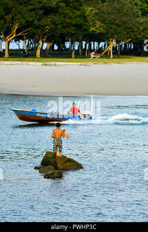 Old fisherman casting net Stock Photo