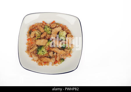 Plate of asian chicken pad thai with vegetables, including broccoli and rice Stock Photo