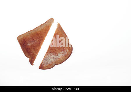 Hot buttered whole wheat toast cut in half Stock Photo