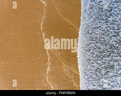 Aerial photography by a drone. Closeup of beach and sand texture from the top view or air. Stock Photo