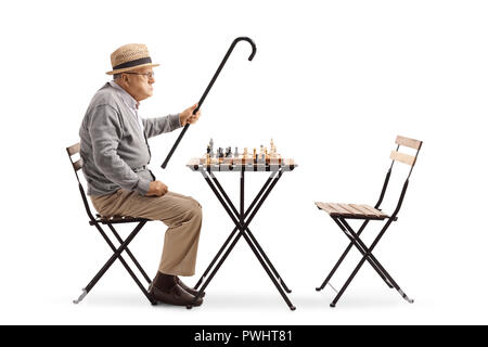 Angry mature man playing chess isolated on white background Stock Photo