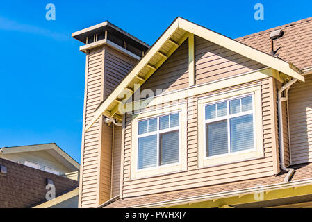 Window on upper level of residential building. Low rise building with ...
