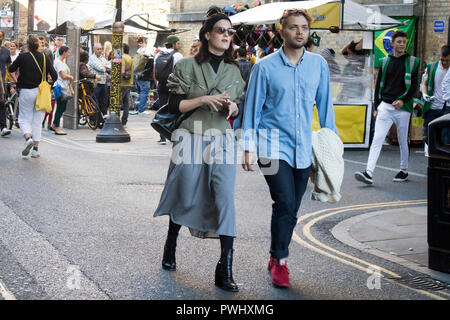 LONDON, UK- SEPTEMBER 14 2018: People on the street at Bricklane East London. Happy couple Stock Photo