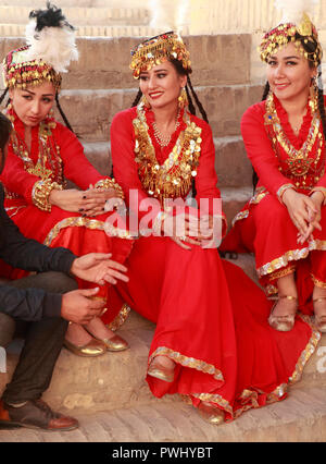 Uzbekistan, Khiva, young women, traditional dress, Stock Photo