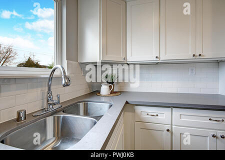 Light interior of kitchen and dining room in American house Stock Photo