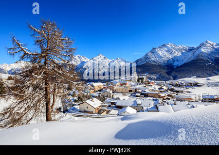 Blue sky on the alpine village of Ftan surrounded by snow Inn district Canton of Graubunden Engadine Switzerland Europe Stock Photo