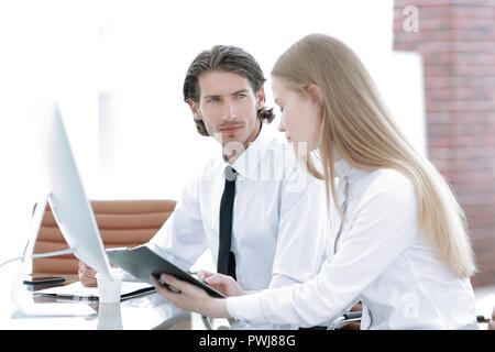 Manager and employee discussing working papers Stock Photo
