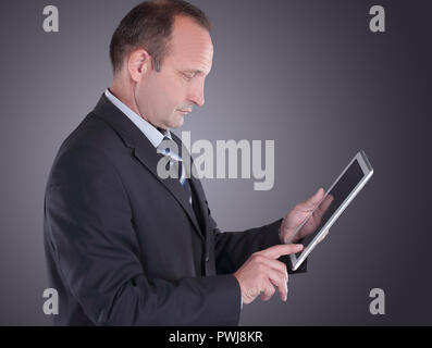 modern businessman with a digital tablet.isolated on black background Stock Photo