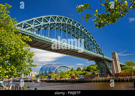 UK, England, Tyneside, Newcastle upon Tyne, Tyne Bridge and Gateshead Sage Centre from River Tyne Quayside Stock Photo