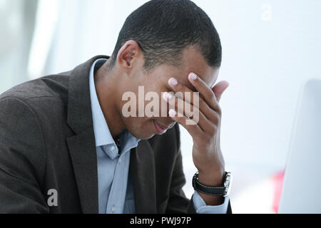 closeup.pensive businessman sitting at the office. photo with copy space Stock Photo