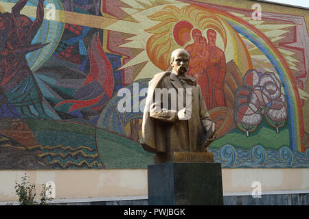 A statue of Shevchenko created in 2002 by sculptor Leonid Grigorievich Ryabtsev in front of Soviet-era mosaic mural monument commemorating Taras Shevchenko who was a notable Ukrainian poet and writer made by artist V. Kutkin in1970. placed in the center of Tashkent capital of Uzbekistan Stock Photo