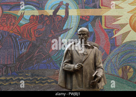 A statue of Shevchenko created in 2002 by sculptor Leonid Grigorievich Ryabtsev in front of Soviet-era mosaic mural monument commemorating Taras Shevchenko who was a notable Ukrainian poet and writer made by artist V. Kutkin in1970. placed in the center of Tashkent capital of Uzbekistan Stock Photo