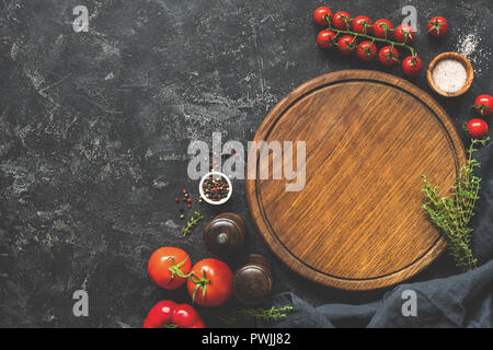 Cutting board, spices and vegetables for cooking. Food background. Top view, copy space for text, recipe or menu Stock Photo