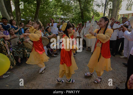 Pamiris dancing at the 'Roof of the World' festival in Khorog, Tajikistan Stock Photo