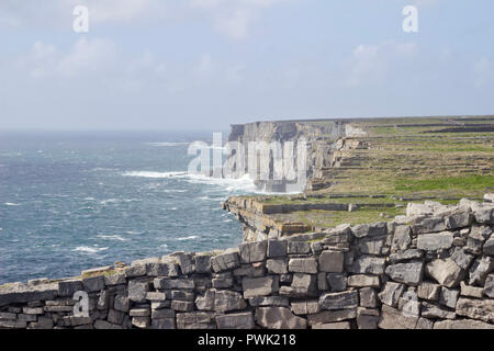 Beautiful view of the cliffs on Inis Mór (Inishmore) from inside the ancient fort of Dún Aonghasa (Dun Aengus) in County Galway, Ireland Stock Photo