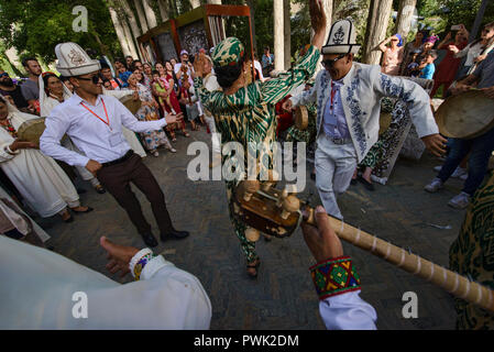 Pamiris dancing at the 'Roof of the World' festival in Khorog, Tajikistan Stock Photo