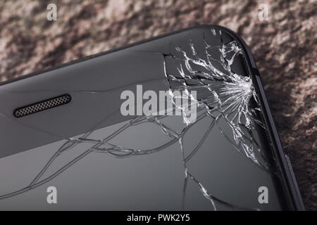 Broken glass on the phone screen, close-up Stock Photo