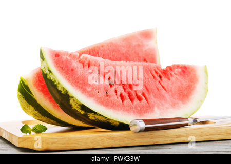 Two ripe watermelon slices on wooden table, close-up. Food background Stock Photo