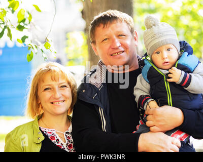 October 14, 2018 - Borisptyl, Kiev, Ukraine - Modern Ukrainian family seen during the celebrations..The Protection of the Virgin is a national holiday celebrated by the Ukrainian Orthodox Church. On this day, at the same time, the holiday of the Ukrainian Cossacks, the Day of the creation of the Ukrainian Rebel Army and the Day of Defender of Ukraine are celebrated. (Credit Image: © Igor Golovniov/SOPA Images via ZUMA Wire) Stock Photo