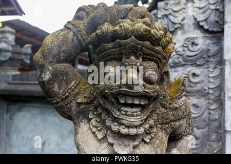 Traditional stone statues depicting demons, gods and Balinese mythological deities in Bali,Indonesia. Stock Photo