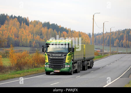 Salo, Finland - October 13, 2018: Green Scania R730 truck of Kuljetus Saarinen Oy in seasonal sugar beet haul on autumnal highway in South of Finland. Stock Photo