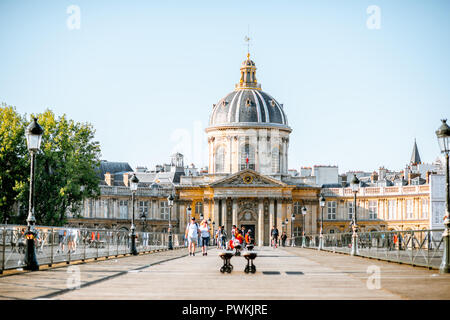 PARIS, FRANCE - September 01, 2018: View on the Institute of France building with people walking on Concordia bridge in Paris Stock Photo
