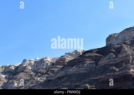 Greece, the island of Santorini.  The sheer cliffs of the Caldera high above the islands port Stock Photo