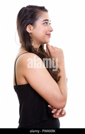 Profile view of young beautiful Indian woman thinking Stock Photo