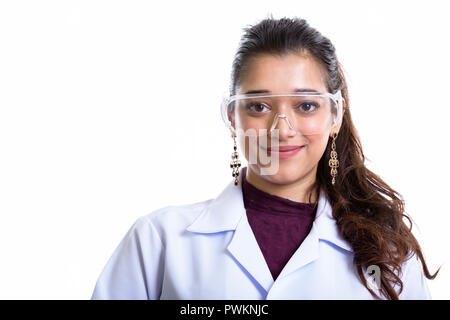 Young beautiful Indian woman doctor wearing protective glasses Stock Photo