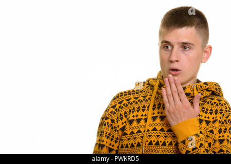 Young Caucasian man looking shocked and surprised Stock Photo