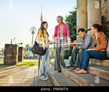 Colleagues discussing an architectural model together. Stock Photo