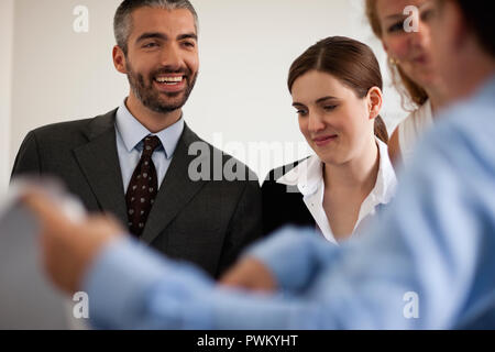Small group of business people in a meeting. Stock Photo