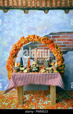 Traditional mexican Day of the dead altar with pan de muerto and candles Stock Photo