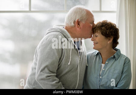 Happy senior couple sitting together. Stock Photo