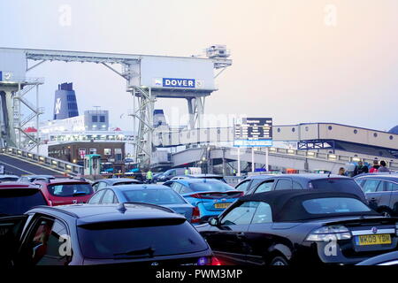 Dover, England - July 27 2018: Cars and vans at the ferry port in early morning, waiting to board the cross channel ferry boat Stock Photo