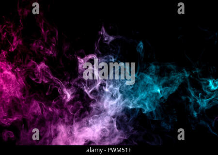 Textural background for creativity . Dense multicolored smoke of   blue and pink colors on a black isolated background. Background of smoke vape Stock Photo